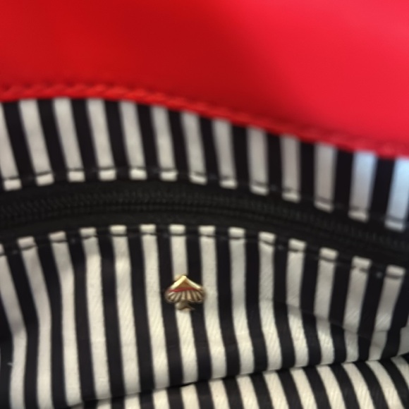 Kate Spade Red cross body purse. Fold over flap style. Zip pocket on front. - Picture 9 of 14